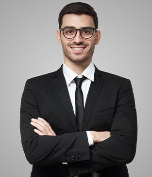portrait-of-smiling-handsome-business-man-standing-LY9NLSY